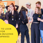 Team-building event at Selfridges shop with long haired female and males in black uniform