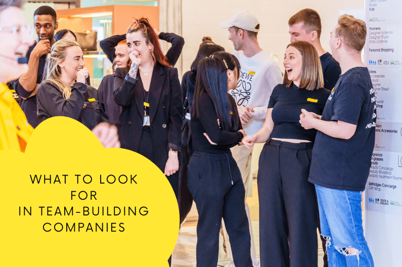 Team-building event at Selfridges shop with long haired female and males in black uniform