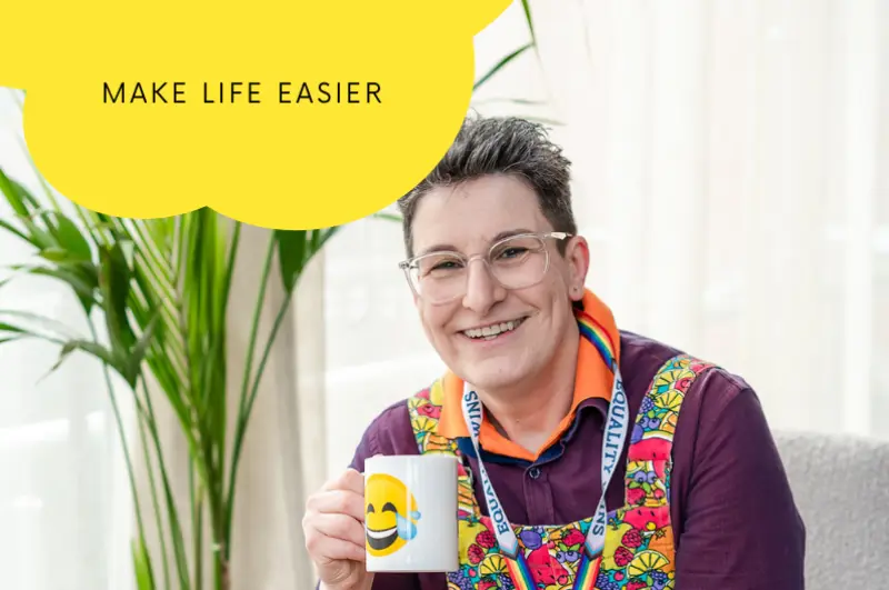 Make life easier dark haired woman smiling and holding smile cup