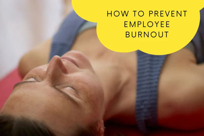 Employee practising Yoga Nidra to prevent burnout during a Serious Laughter corporate wellbeing workshop