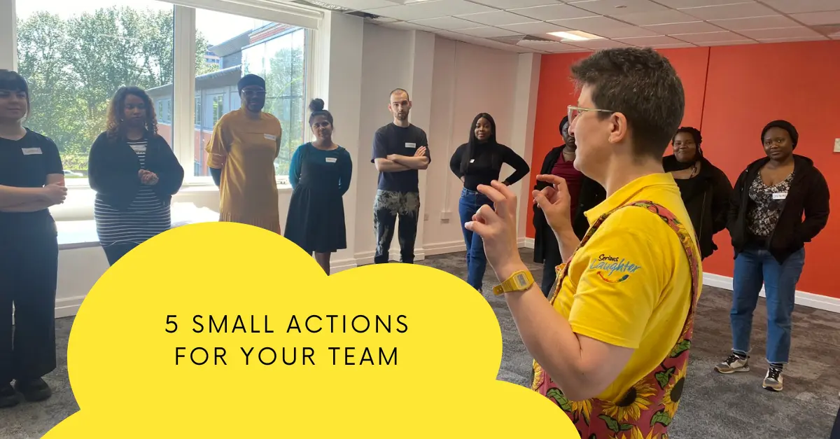 A team of colleagues laughing and connecting together in a workplace wellbeing session