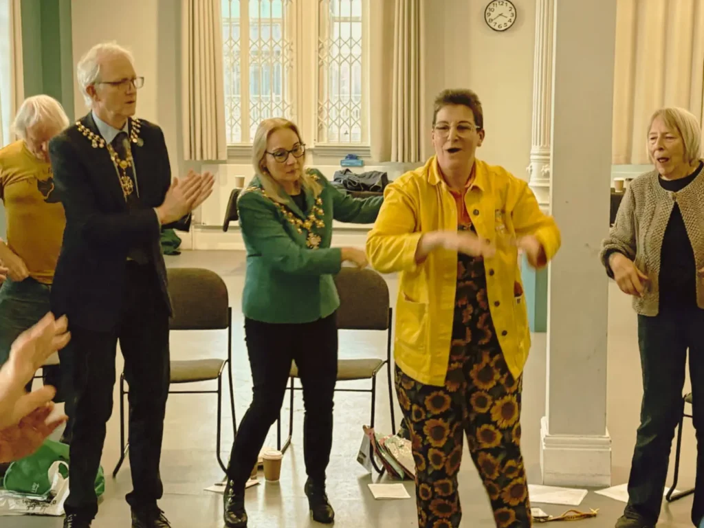 Sunny Turner, founder of Serious Laughter, leading a Laughter Yoga session