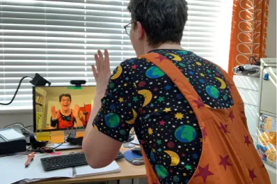 Sunny Turner facilitating an online Laughter Yoga class on Zoom with Serious Laughter - open to everyone across the UK