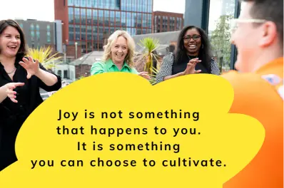 A group of people sharing a moment of calm connection and joy during a Serious Laughter wellbeing session